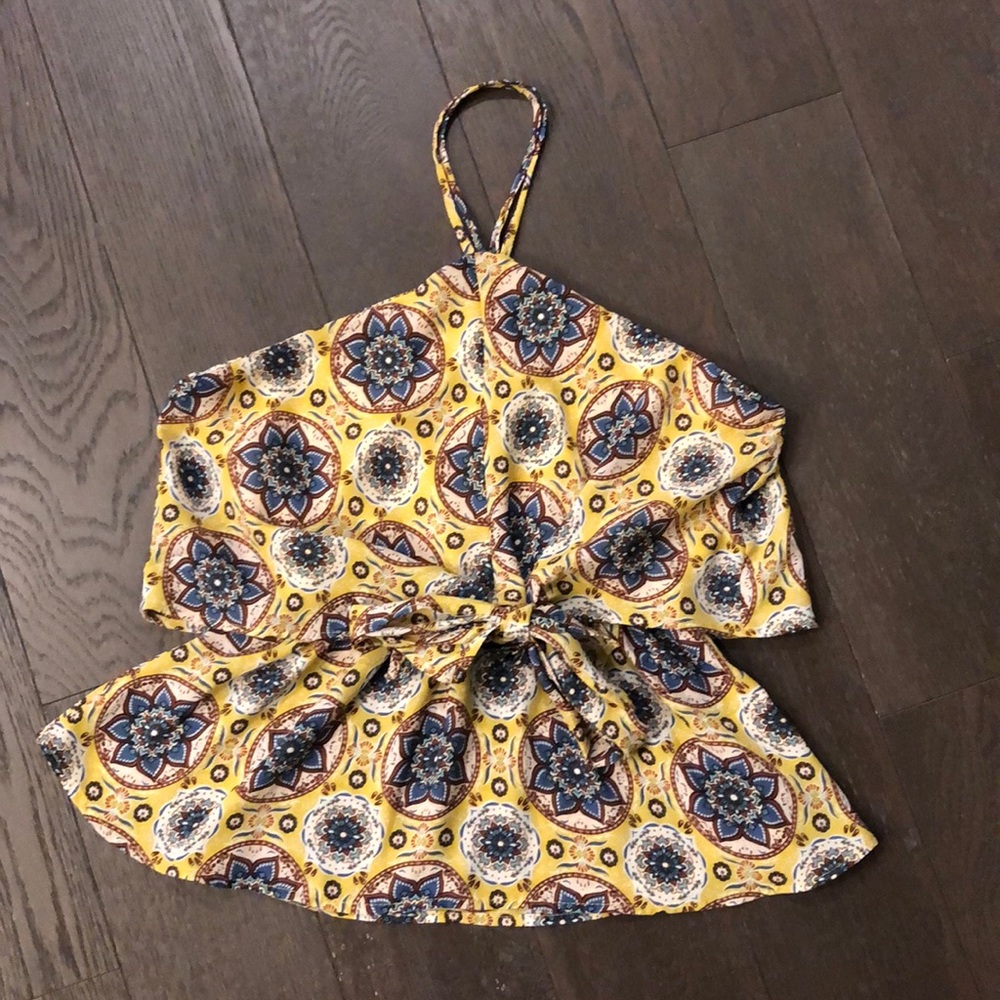 Yellow sleeveless top with blue flowers